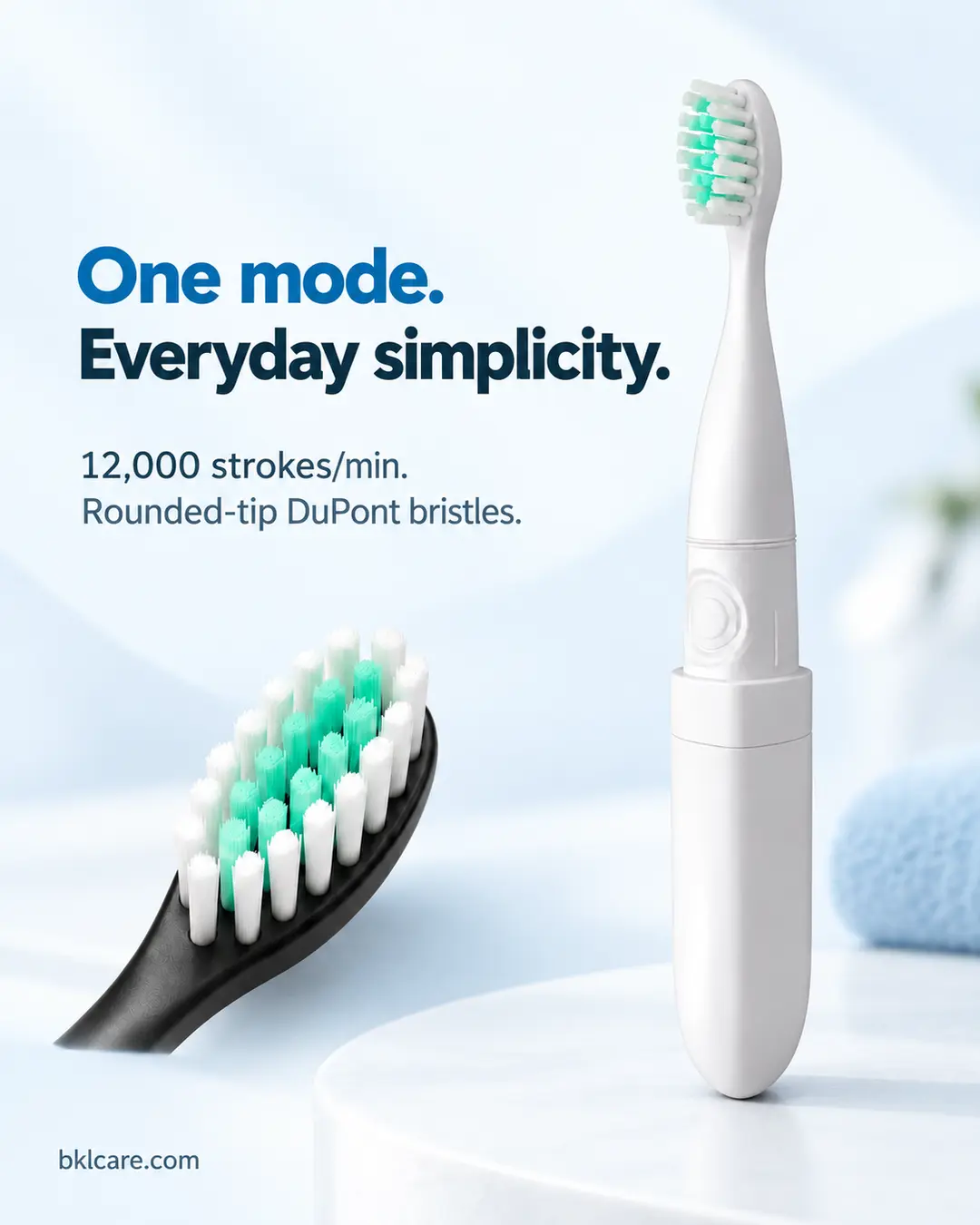 White BJ-MA002 one-mode electric toothbrush beside a close-up of its mint and white bristle tufts.